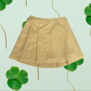 Yellow pleated mini skirt